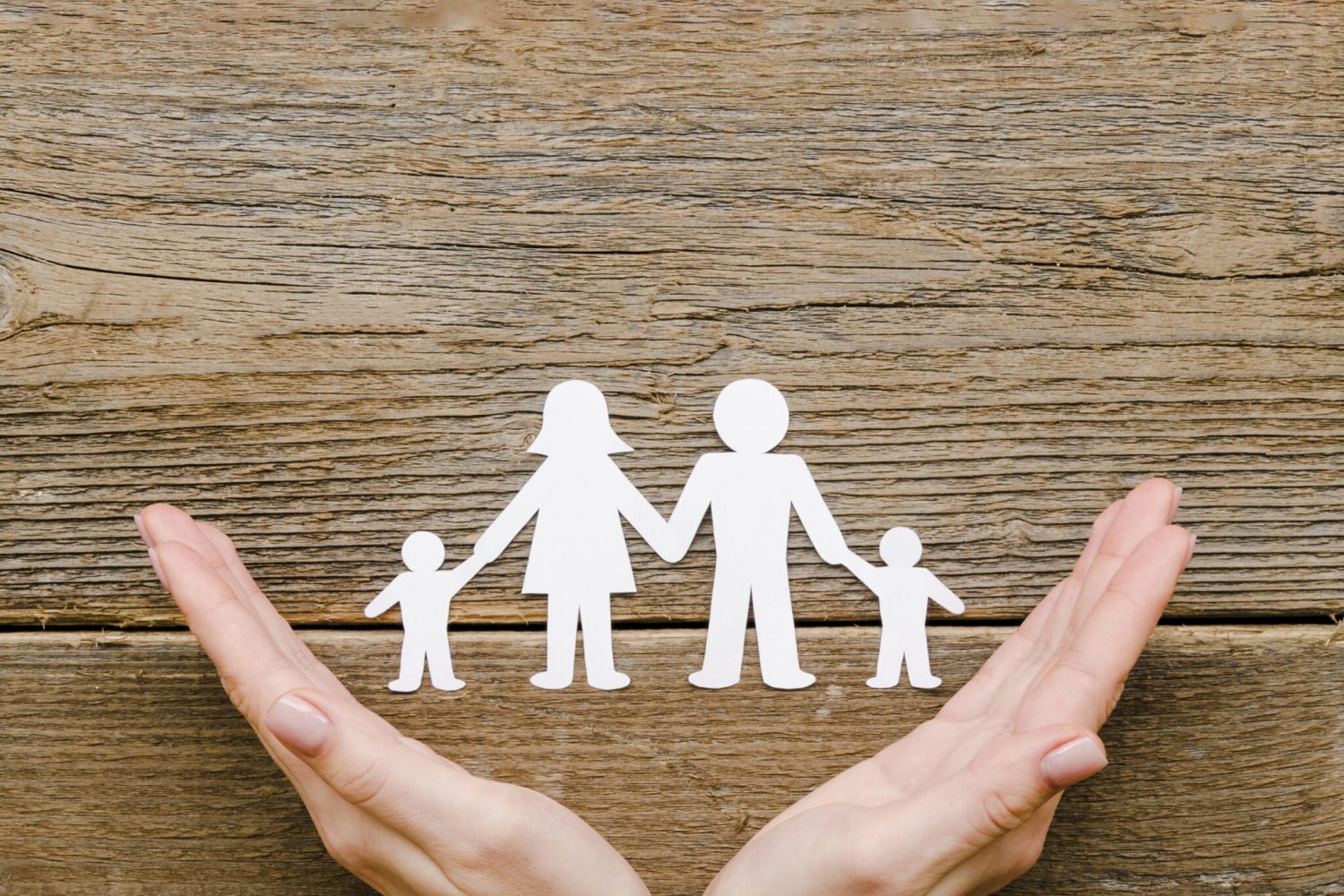 paper-family-composition-wooden-background-with-copy-space-scaled.jpg
